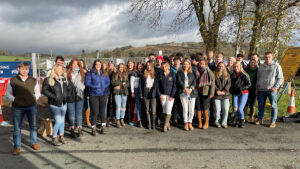 A crowd of students form the Harper Cymru Society pose for a photo on a trip to the royal welsh winter fair.